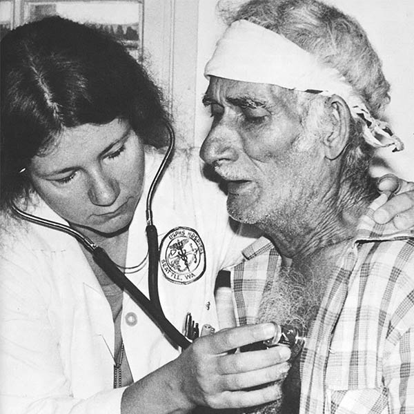 man being attend to by nurse