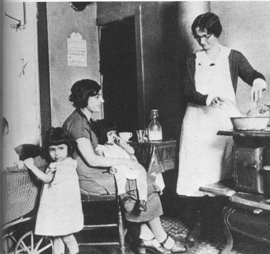 vintage photo of mother with children talking to nurse